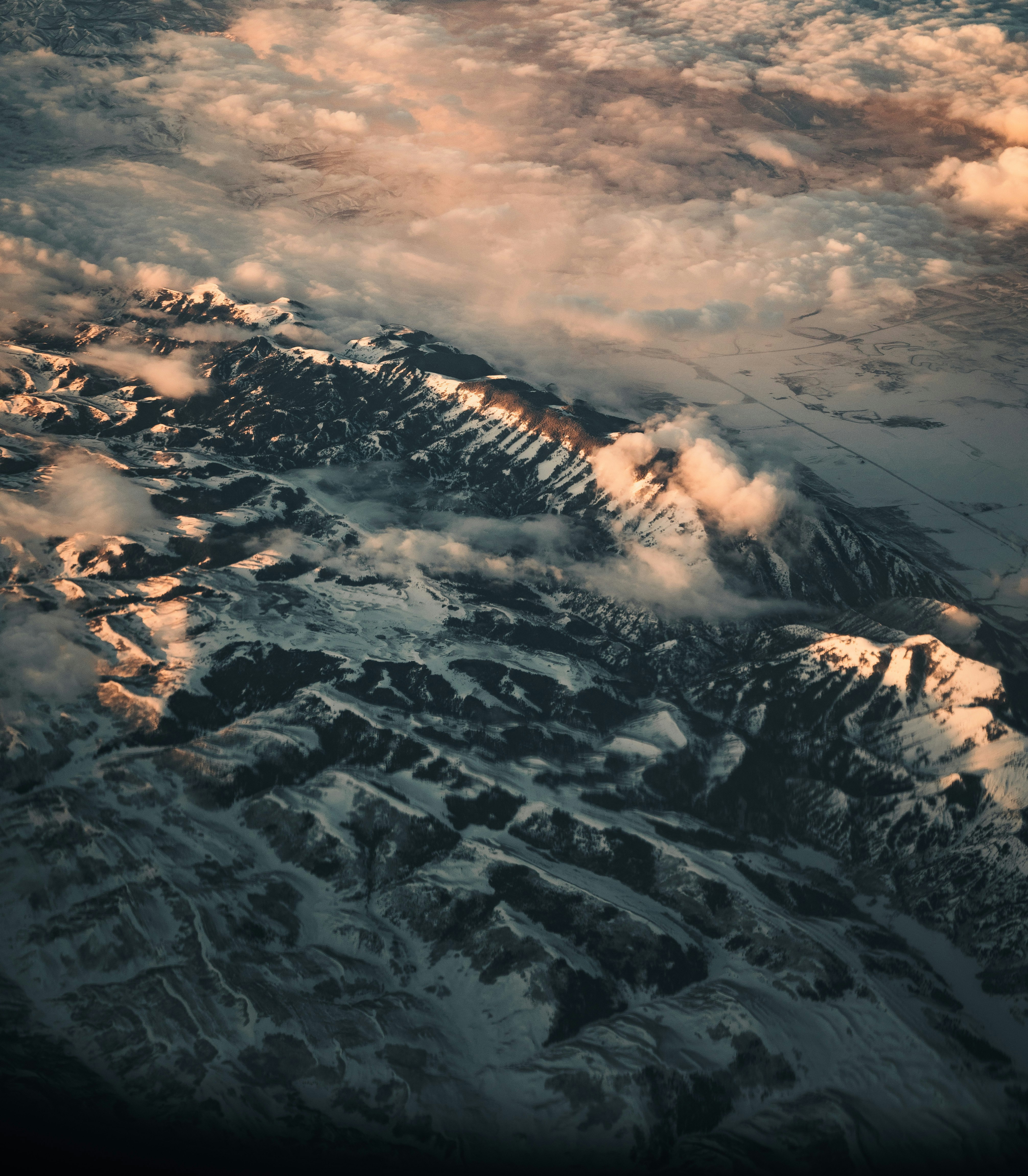 aerial view of snow covered mountains during daytime